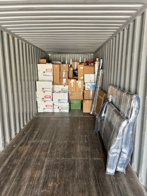 A shipping container filled with boxes at a moving company in Casper Wyoming.