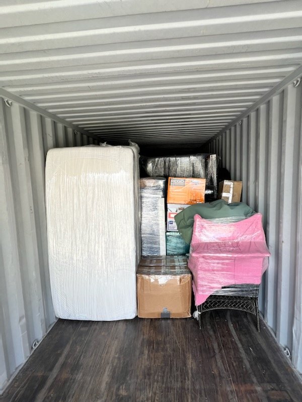A shipping container filled with furniture provided by a moving company in Casper, Wyoming.