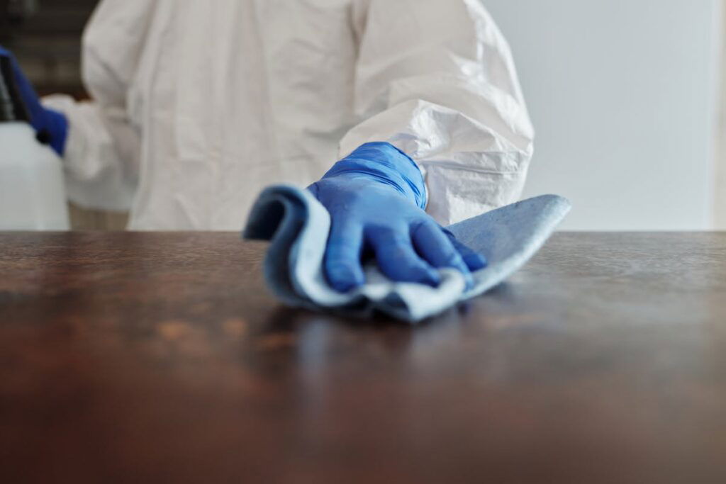 A person in a protective suit providing spotless cleaning services.